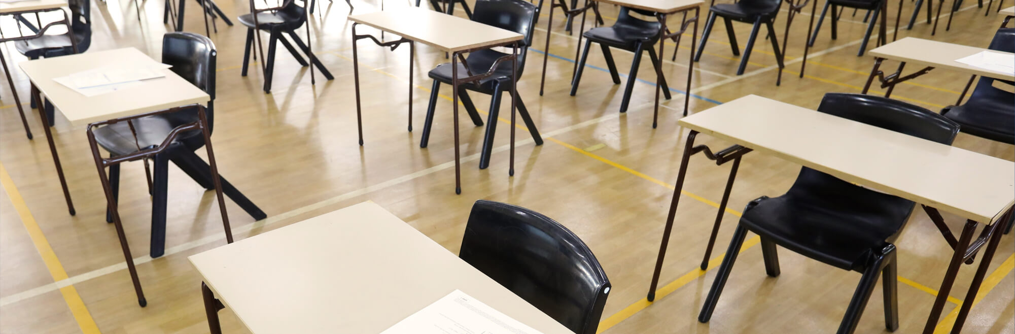 Exam desks in school hall
